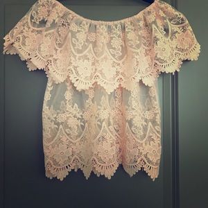 Unworn lace top. Requires coverage underneath.